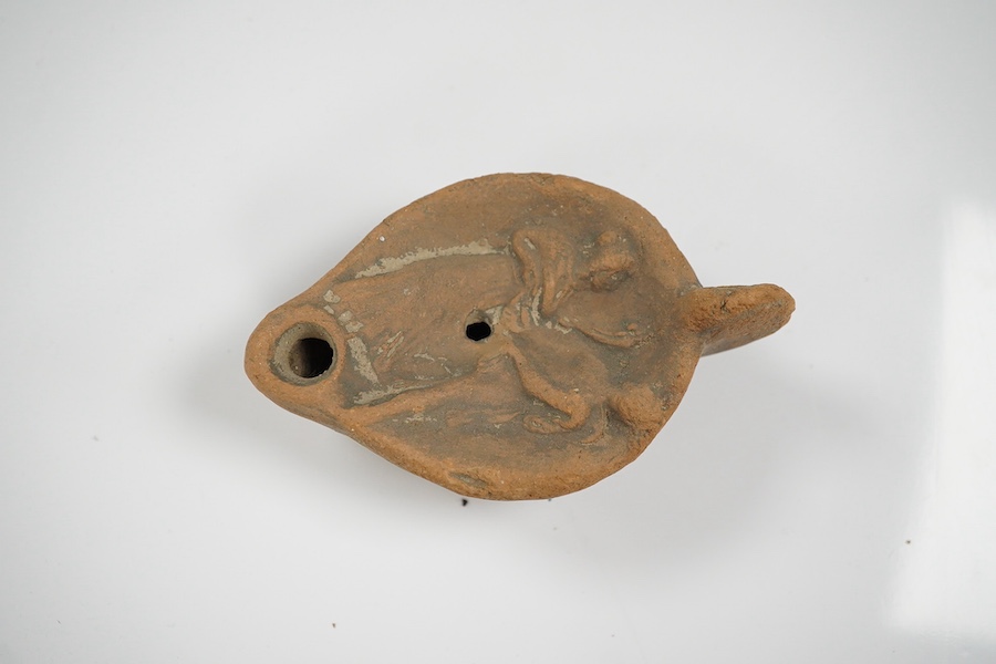 An Ancient Greek 'Athens' terracotta oil lamp, 10cm. Condition - fair